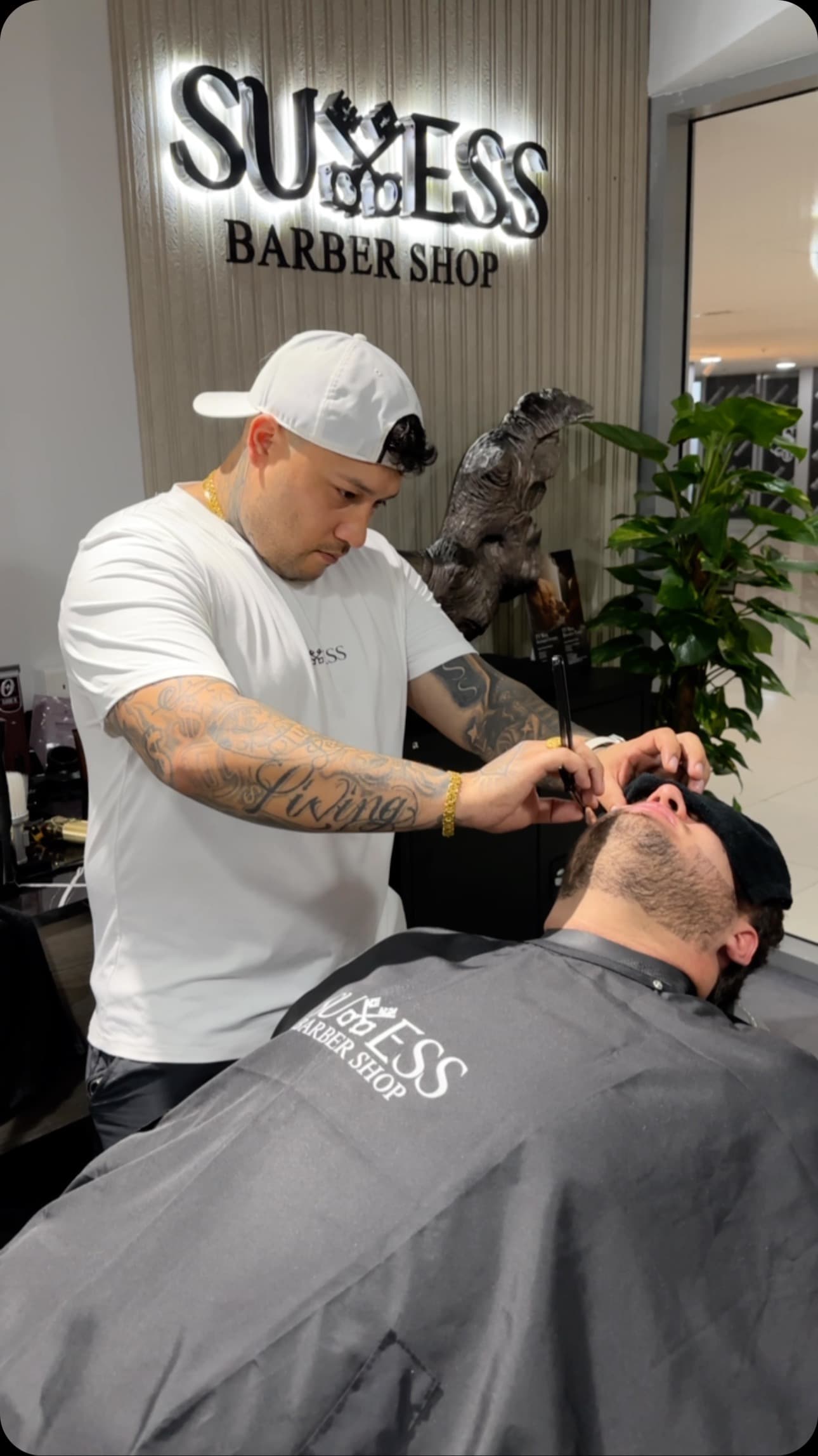 Straight razor shave with hot towel at Success Barbershop